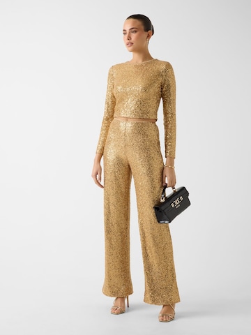 GUESS Flared Pants in Gold