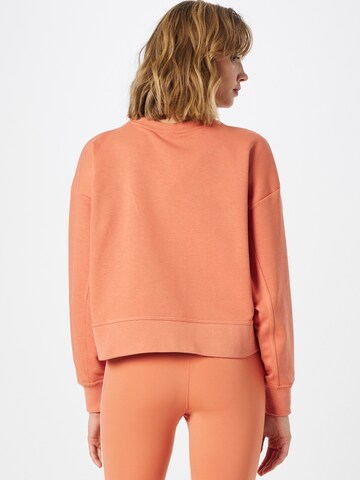 oranžinė NIKE Sportinio tipo megztinis
