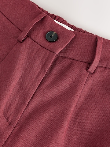 Wide leg Pantaloni con piega frontale di Next in marrone