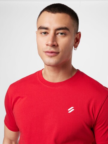 T-Shirt fonctionnel Superdry en rouge