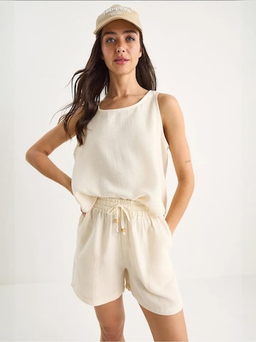 Pantalons de tailleur Bianco Lucci en beige : devant