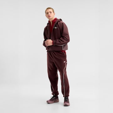 new balance - Perna larga Calças 'Trackside Polar Fleece Jogger' em vermelho