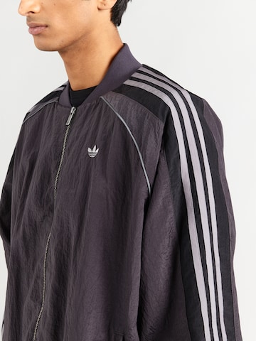 ADIDAS ORIGINALS Átmeneti dzseki 'Adilenium' - fekete