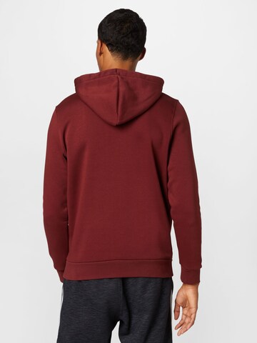 UNDER ARMOUR Sportsweatshirt 'Essential' in Rot