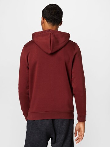 UNDER ARMOUR - Sweatshirt de desporto 'Essential' em vermelho