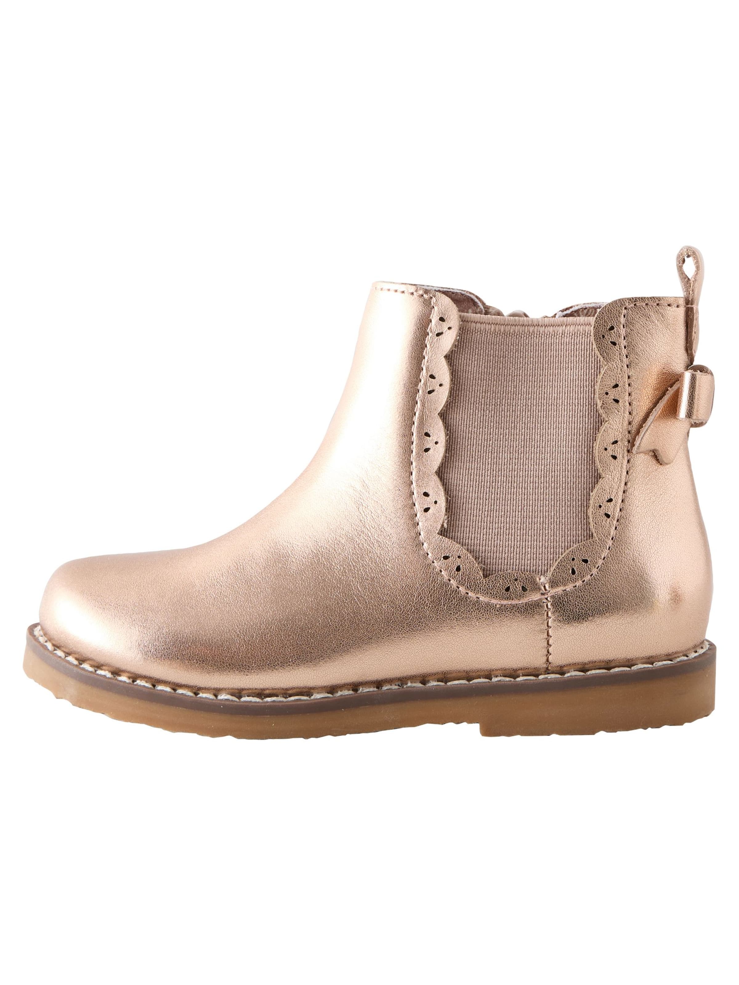 Next - Botas en oro: frente