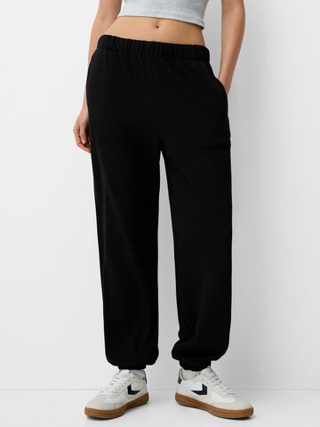 Tapered Pantaloni di Bershka in nero