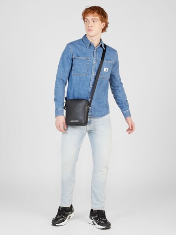 Coupe slim Jean 'SLIM TAPER' Calvin Klein Jeans en bleu