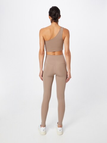 Girlfriend Collective Skinny Sporthose in Braun