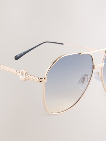 Lunettes de soleil Next en or