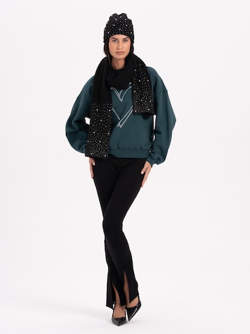 juoda MYLAVIE by Sarah Harrison Megzta kepurė 'Knitted hat with glitter'