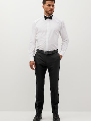 Slimfit Pantaloni con piega frontale di Next in nero