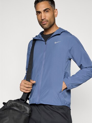 NIKE Trainingsjack 'Form' in Blauw