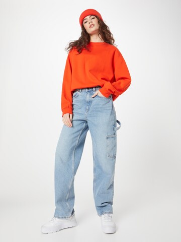 Sweat-shirt 'Essence Standard' WEEKDAY en orange