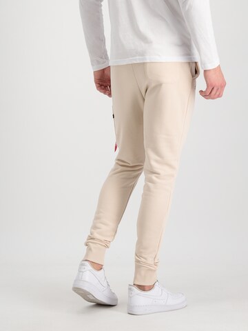 Effilé Pantalon 'X-Fit' ALPHA INDUSTRIES en beige