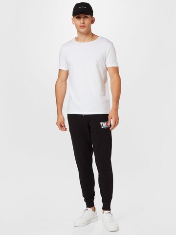 Tapered Pantaloni de la Tommy Jeans pe negru