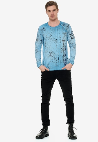 Rusty Neal Cooles Langarmshirt mit Allover-Print in Blau