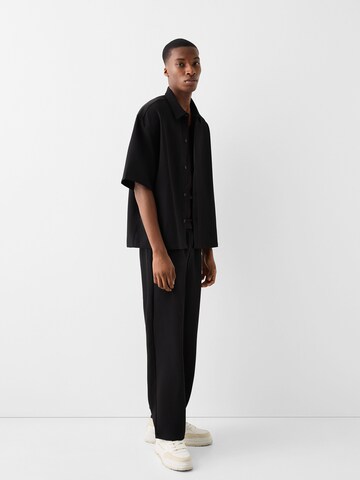Bershka Voľný strih Nohavice - Čierna
