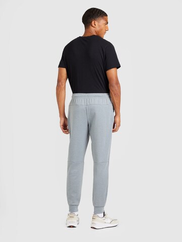 Effilé Pantalon de sport 'PRIMARY' NIKE en gris