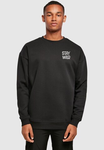 Merchcode Sweatshirt 'Stay Wild' in Zwart: voorkant