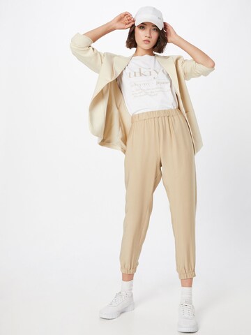 Tapered Pantaloni 'Mercy' di Karo Kauer in beige