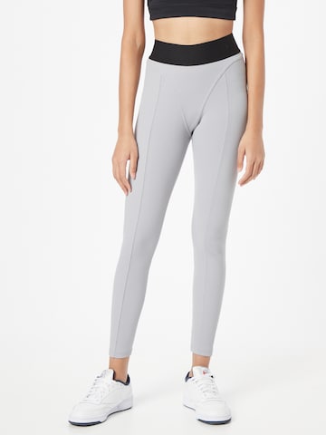 Skinny Leggings de la Reebok pe gri: față