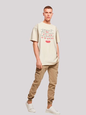 F4NT4STIC T-Shirt 'Stranger Things In Your Dreams Netflix TV Series' in Beige