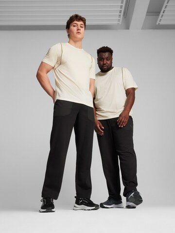 Regular Pantalon de sport 'Concept' PUMA en noir : devant