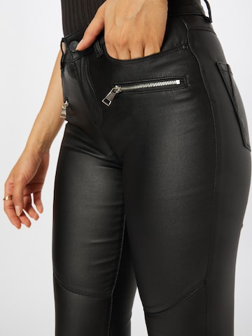 Skinny Pantaloni 'ANNE' de la ONLY pe negru
