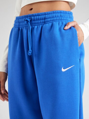 Nike Sportswear Loosefit Kalhoty 'Phoenix Fleece' – modrá