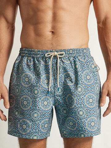 IUMAN Intimissimi Board Shorts in Blue: front