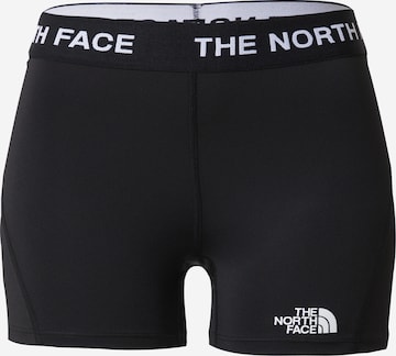 THE NORTH FACE Skinny Workout Pants in Black: front