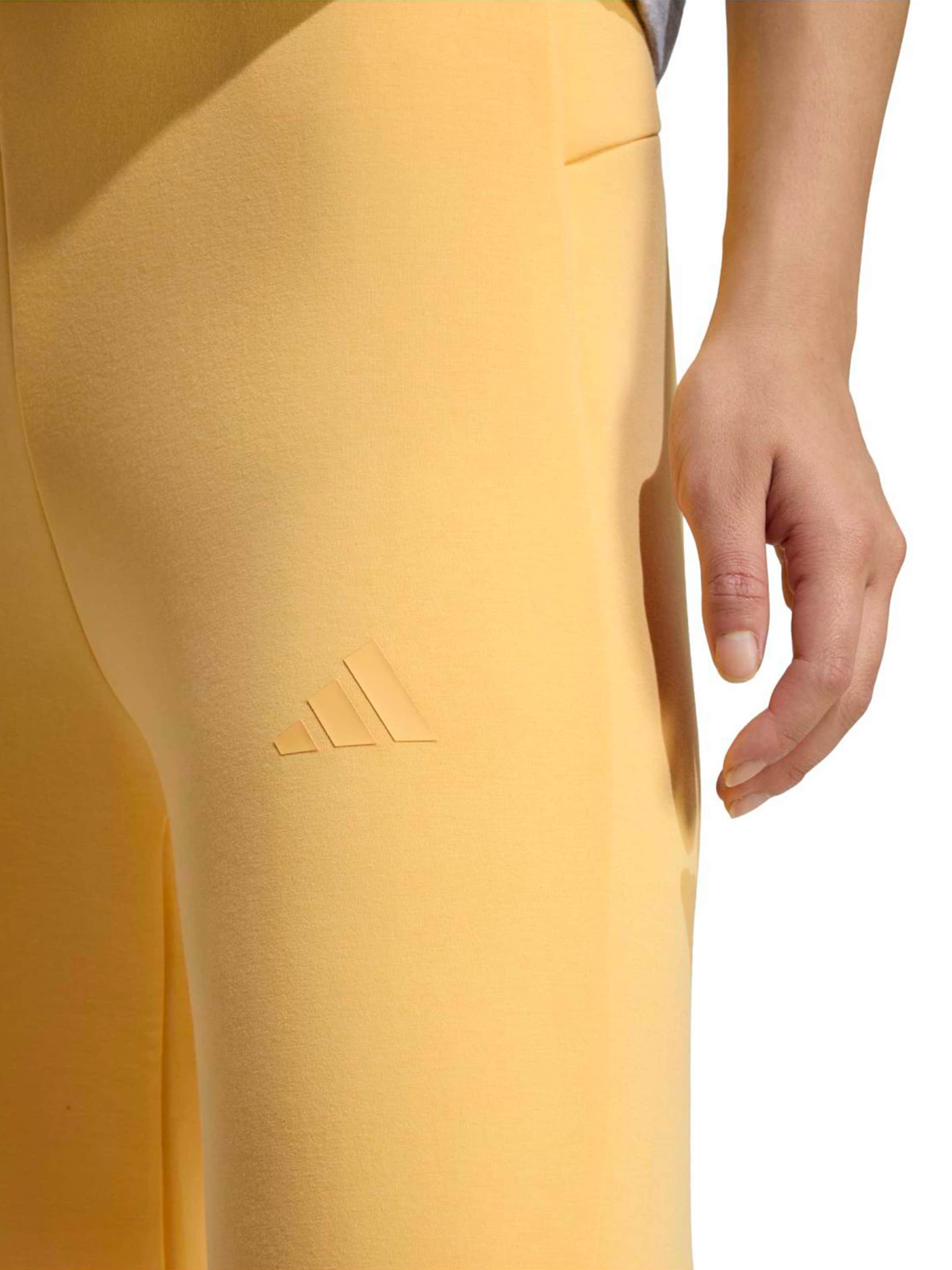 ADIDAS SPORTSWEAR Flared Sportnadrágok 'ALL SZN' - sárga