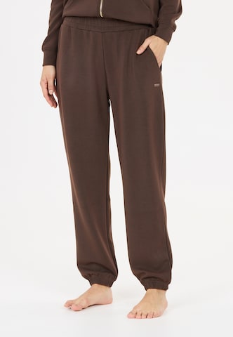 Athlecia Tapered Sportbroek 'Jillnana V2' in Bruin: voorkant