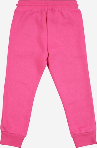 CONVERSE Zwężany krój Spodnie w kolorze różowy