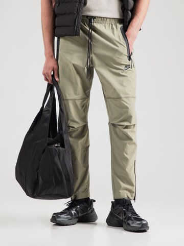 Nike Sportswear Tapered Trousers in Green: front
