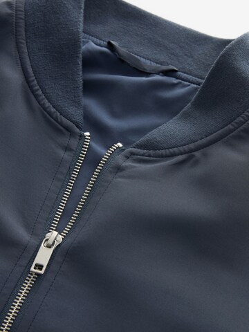 Next Tussenjas in Blauw
