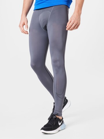 NIKE Skinny Workout Pants in Grey: front