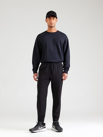 UNDER ARMOUR - regular Pantalón deportivo 'Velociti' en negro