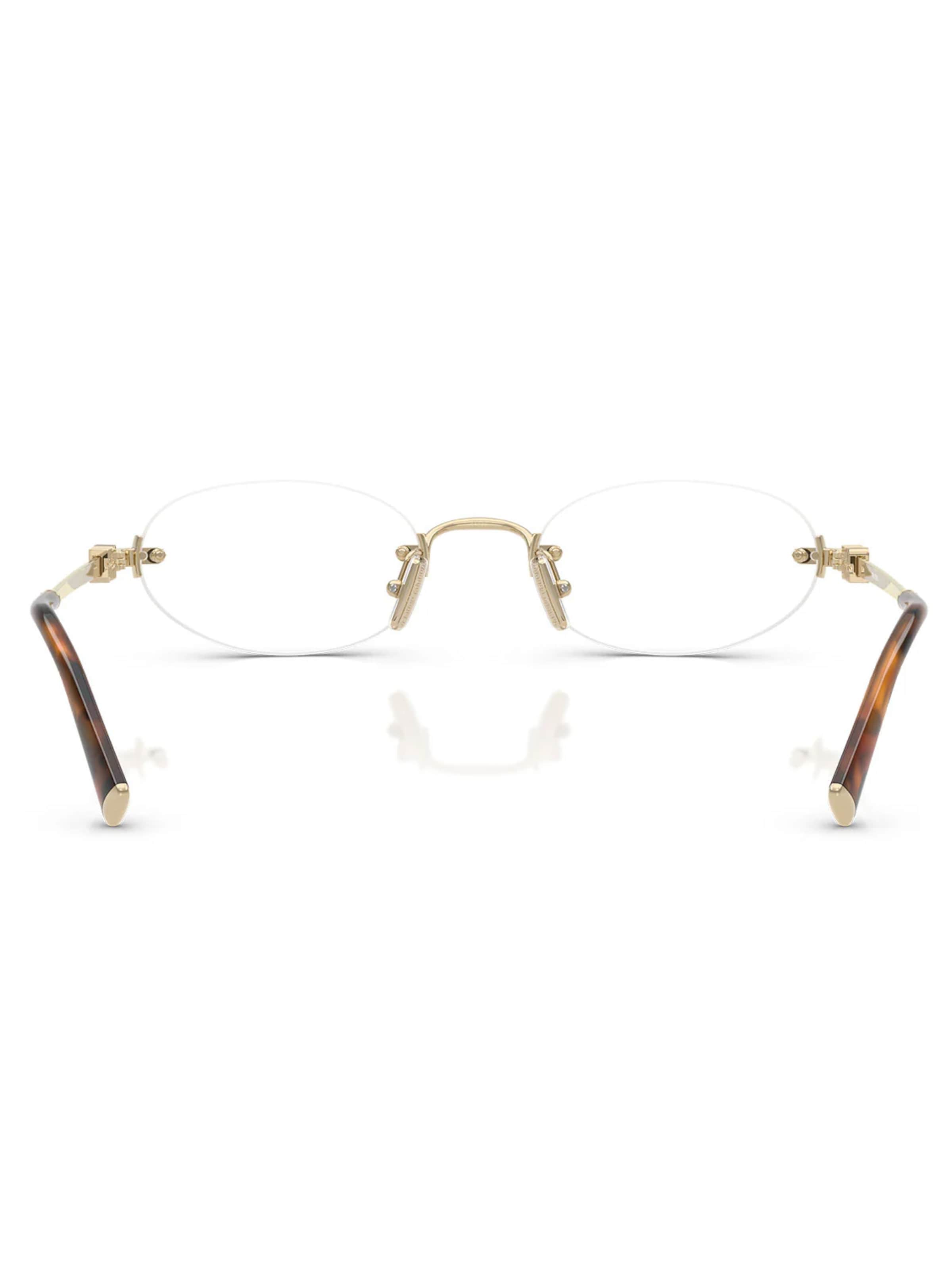 Miu Miu Glasses in Gold