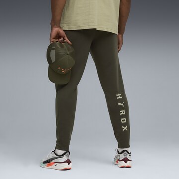PUMA Regular Sports trousers in Green