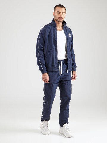 Champion Authentic Athletic Apparel Tracksuit in Blue