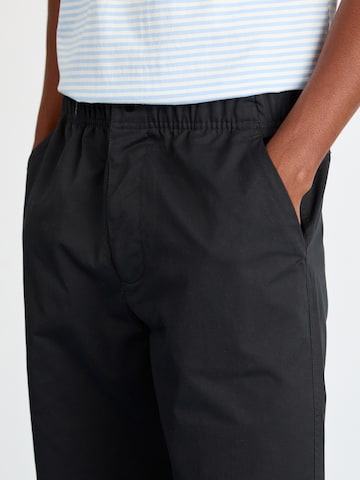 ELLESSE Loose fit Trousers 'Cagola' in Black