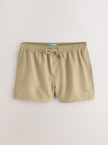 Next Uimashortsit 'Essential' värissä beige