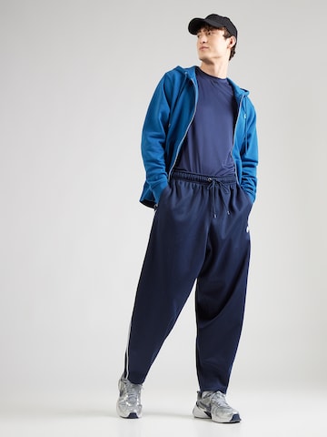 Nike Sportswear Loosefit Housut 'CLUB' värissä sininen