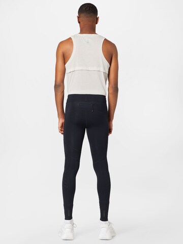 UNDER ARMOUR Skinny Sportovní kalhoty 'Speedpocket' – černá