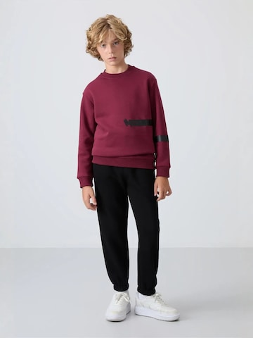 Tommy Life Broek 'TOMMY Kinder Jogginghose' in Zwart