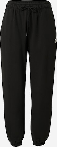 PUMA Tapered Sports trousers 'PUMAxABOUT YOU' in Black: front