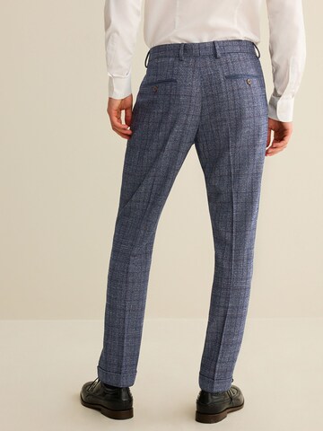 Coupe slim Pantalon à plis Next en bleu