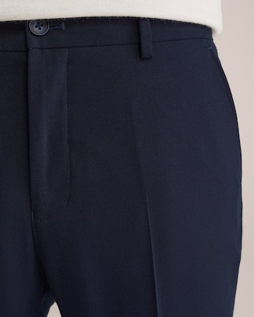 WE Fashion Slimfit Pressveckad byxa i blå